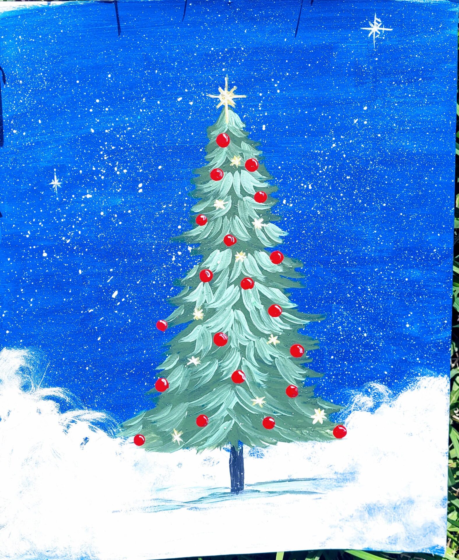 A Christmas Tree Painting on a Canvas Board